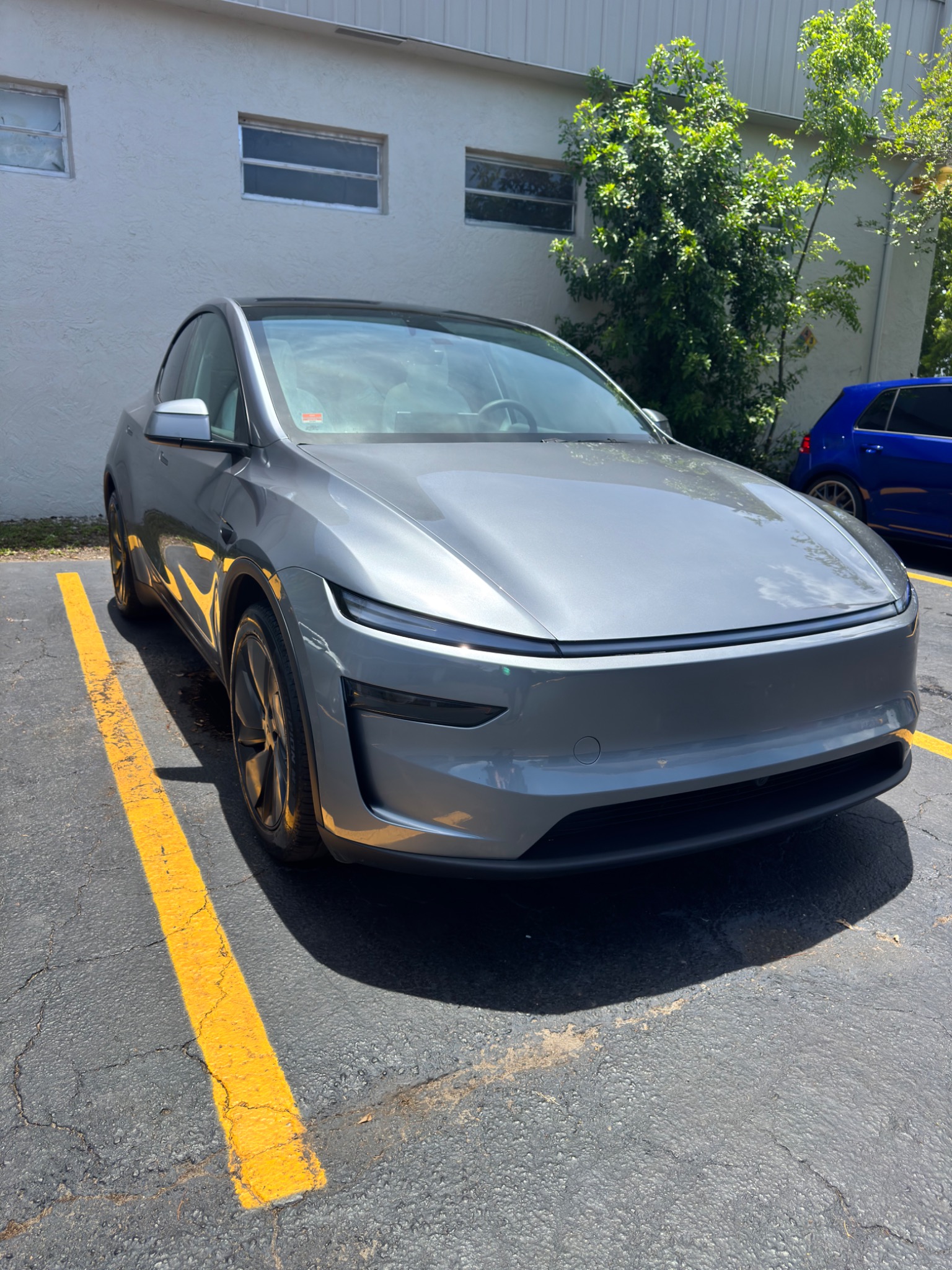 Tesla Model Y new generation gray customer vehicle TSL EV Center South Florida
