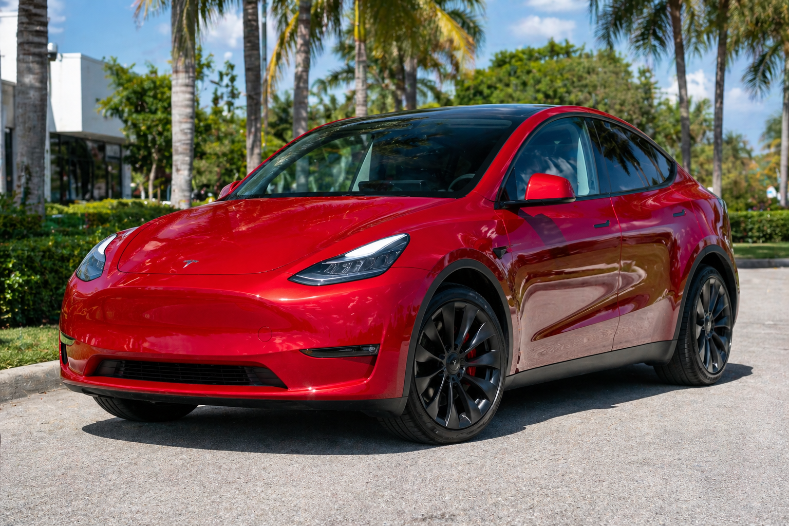 Tesla Model Y red serviced at TSL EV Center Lauderhill FL